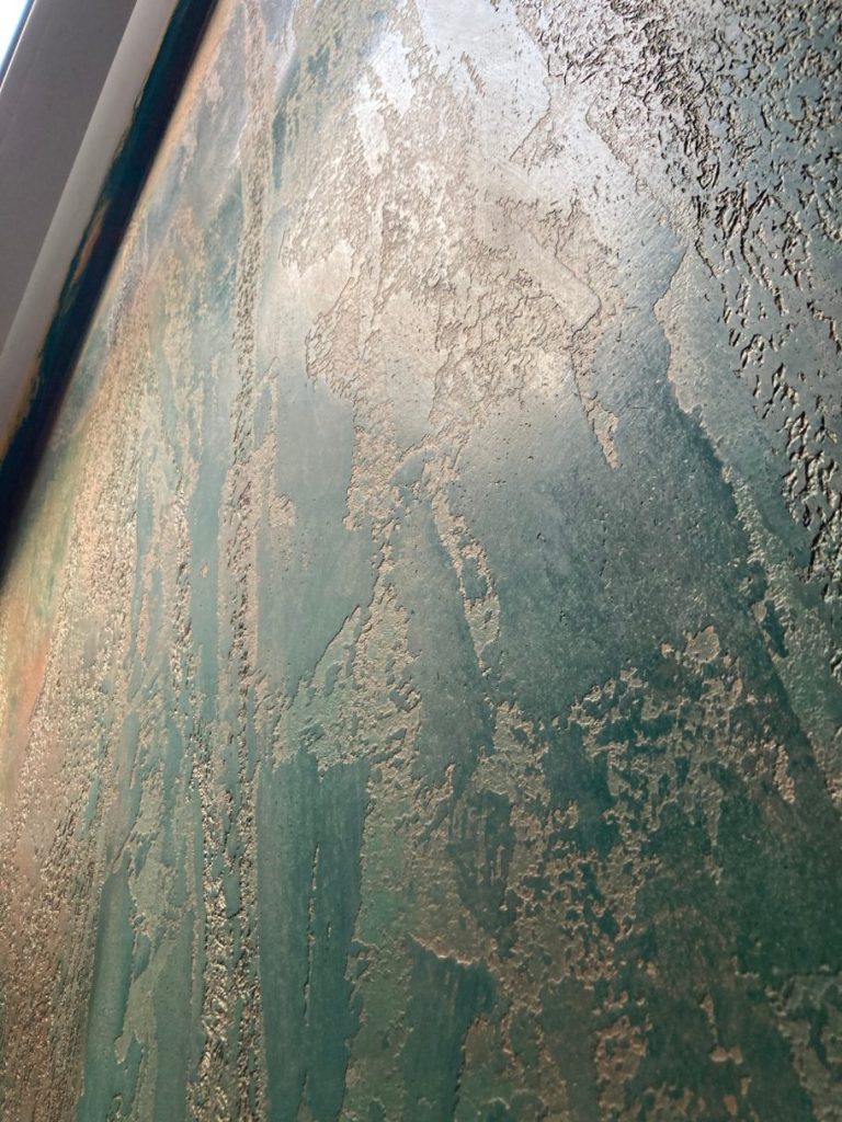 Texturierte Wand in Grüntönen